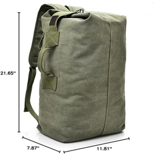 Large army green canvas travel backpack with durable cylindrical design and side handle