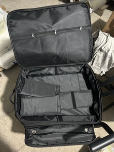 Spacious black nylon pin collection bag with adjustable dividers and mesh zipper pockets