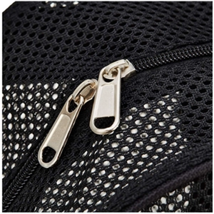 Detailed close-up of durable dual metal zippers on black breathable mesh backpack fabric