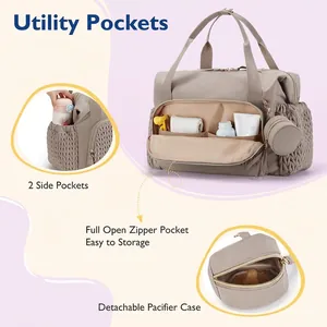 Large khaki travel diaper bag with side pockets and detachable pacifier case