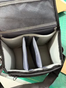 Detail view of adjustable dividers and mesh pocket inside the waterproof camera bag