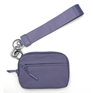 Waterproof lilac nylon wristlet wallet with double zipper pockets and woven hand strap