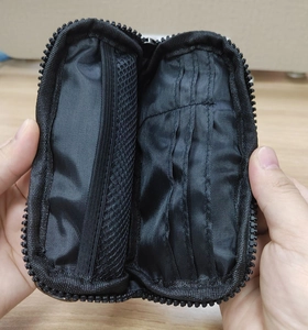 Detail of waterproof nylon wallet interior featuring mesh pocket and multiple card slots