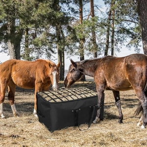 Durable slow feed hay bag for horses featuring black mesh grid for outdoor stable feeding