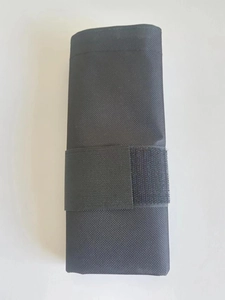 Detail of durable black nylon tent weight sandbag with velcro closure and mesh texture
