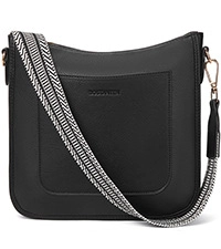 Detail of black pebbled vegan leather crossbody bag with woven black and white wide strap
