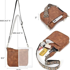 Brown vegan leather crossbody bag with bohemian wide strap and interior capacity view