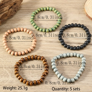 Detail view of five multicolor 8mm wooden bead stretch bracelets with size and weight info