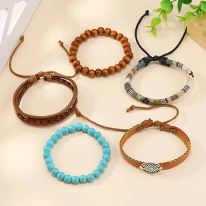 Five-piece bohemian bracelet set with turquoise beads, wood, and braided leather straps