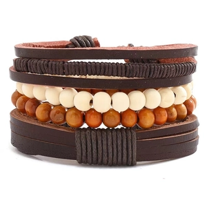 Detail of vintage multilayer leather bracelet with woven cords and wooden beads
