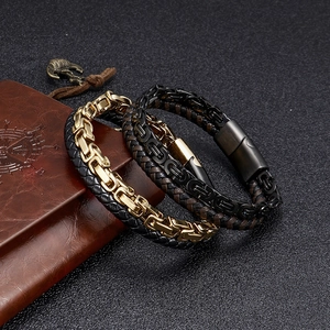 Detail of woven leather bracelets with Byzantine metal chains and magnetic clasps