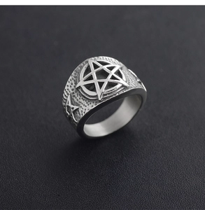 Detailed view of vintage punk pentagram ring with hammer texture finish