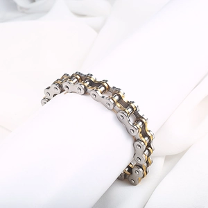 Detail of silver and gold stainless steel bike chain bracelet for men with metallic luster