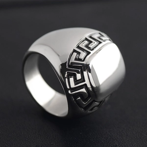 Polished stainless steel signet ring for men featuring a classic Greek meander pattern