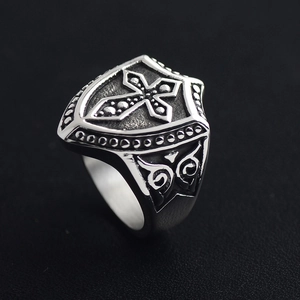 Vintage stainless steel crusader shield ring with cross and scrollwork pattern