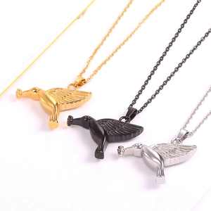 Hummingbird essential oil perfume bottle pendant necklace in gold, black, and silver steel