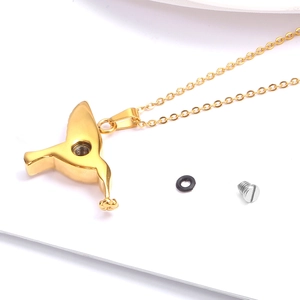 Golden hummingbird cremation necklace with screw closure for memorial ashes