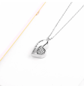 Detail of heart urn necklace with Forever In My Heart engraving and shiny crystals