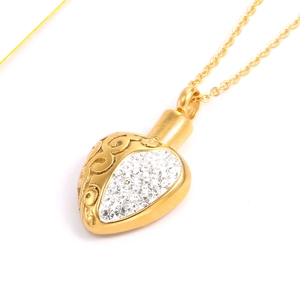 Collier flacon de parfum en forme de cœur doré avec gravure et cristaux brillants