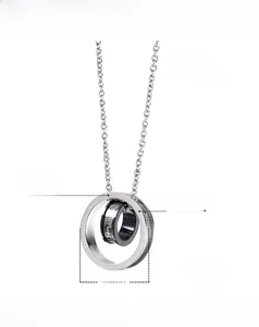 Detailed view of 23mm double ring titanium pendant with cross and black inner band