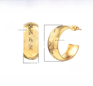 Detail of C-shaped stainless steel earrings with etched X-pattern and high polished finish