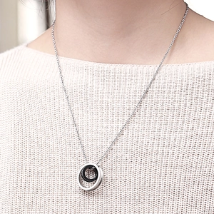 Double interlocking ring pendant necklace in black and silver polished stainless steel