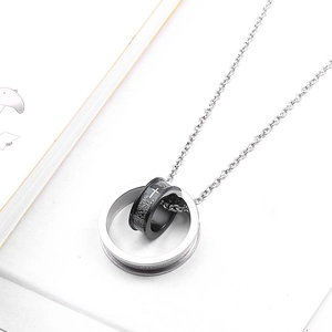 Dual-ring cross pendant necklace in stainless steel with Spanish prayer engraving