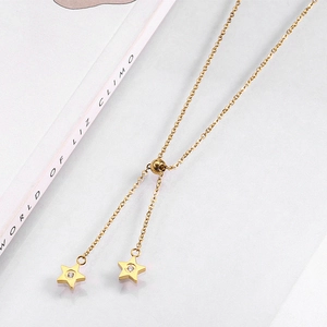Detail of gold Y-shaped necklace with star pendants and adjustable slider clasp