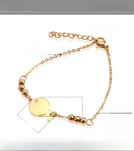 Detailed specs of fish charm bracelet in gold titanium steel with small diamond