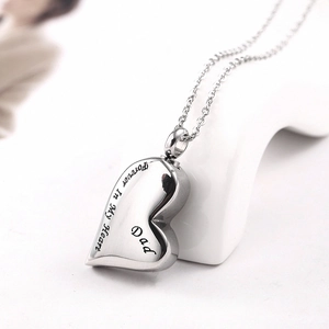 Macro view of DAD heart cremation urn necklace with Forever In My Heart engraving