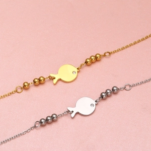 Minimalist fish-shaped stainless steel bracelet set in gold and silver with zircon eye