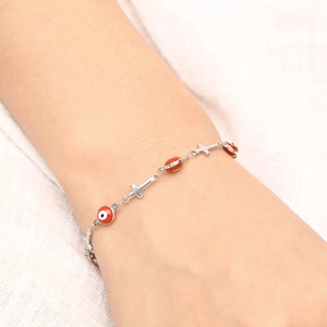 Bracelet en titane plaqué or 18 carats avec œil protecteur et charmes de croix en argent
