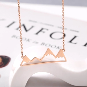 Minimalist 18K rose gold mountain peak pendant necklace for women with a sleek cable chain