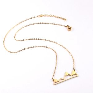 Minimalist 18K gold-plated mountain pendant necklace with adjustable chain on white background