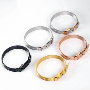 Close-up of Milanese stainless steel mesh bracelets in gold, silver, and rose gold