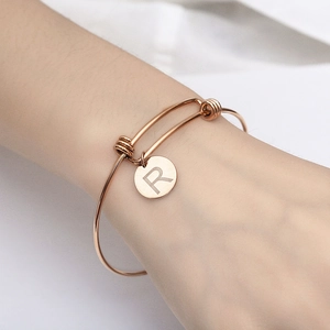 Adjustable rose gold titanium steel bracelet with round engraved letter R pendant