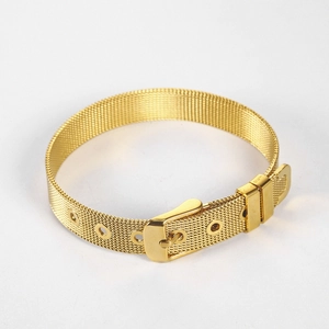Detail of adjustable gold mesh bracelet with buckle closure and polished metal texture