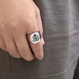 Men's stainless steel signet ring with American eagle seal emblem on hand