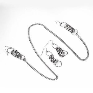 Set orecchini e collana integrati in acciaio al titanio con design a catena cubana argento