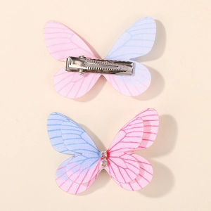 Detailed view of colorful glitter butterfly hair clips with pink blue gradient and crystals