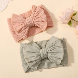 Baby headband set with large bow and cable knit texture in pink and sage green colors