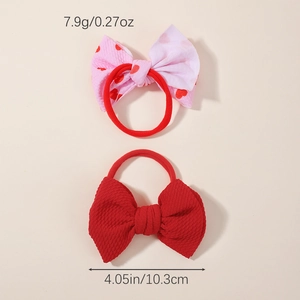 Detailed size and weight view of pink heart and red waffle bow headbands for kids