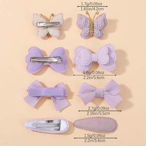 Lot de quatre barrettes à cheveux violettes avec nœuds aux motifs et textures variés