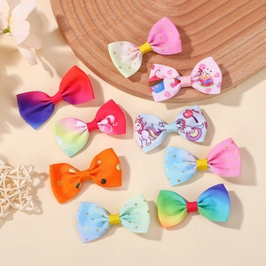 Detailed macro view of 9-piece set of rainbow unicorn hair clips with glitter textures