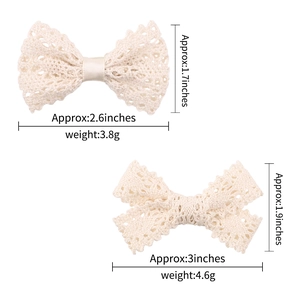 Set of two off-white lace bow hair clips in small and large sizes with measurements