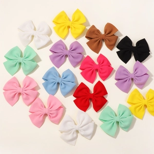 Set da 16 pezzi di fasce con fiocchi colorati in tessuto goffrato per bambine