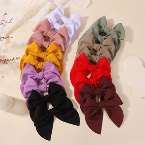 Set of colorful waffle texture bow hairclips for girls in a variety of vibrant sweet colors