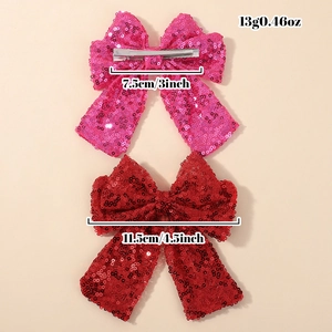 Sparkly sequin bow hair clips for girls in pink and red with metal duckbill clips