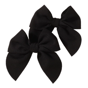 Set of two black ribbed fabric bow hair clips for girls with a textured design