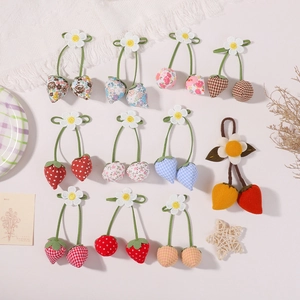 Handmade floral and checkered fabric strawberry charms with daisies for hair accessories